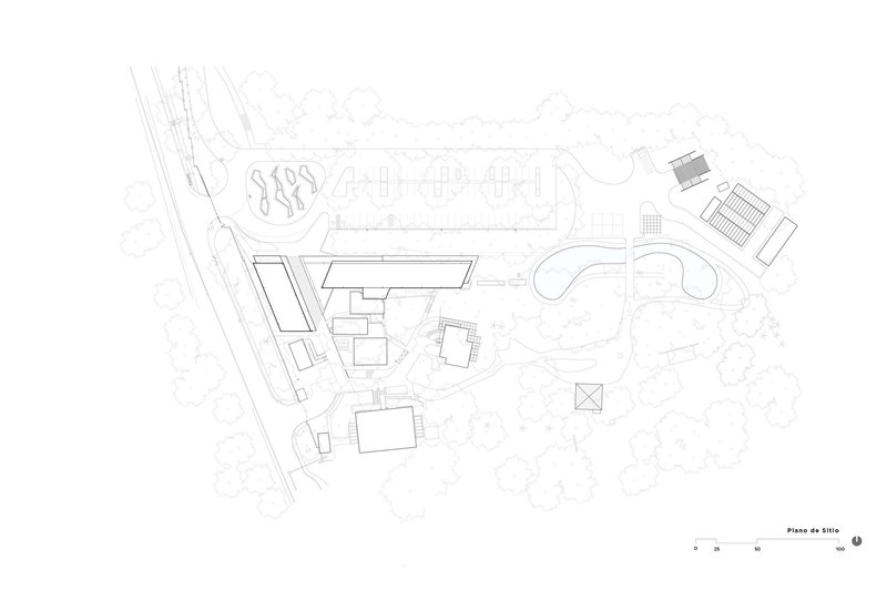 Site plan drawing showing building footprints, pathways, and surrounding landscape elements