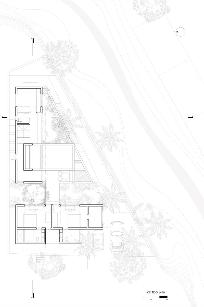 First floor plan drawing showing residential rooms arranged around a triangular site with palm trees and landscaping