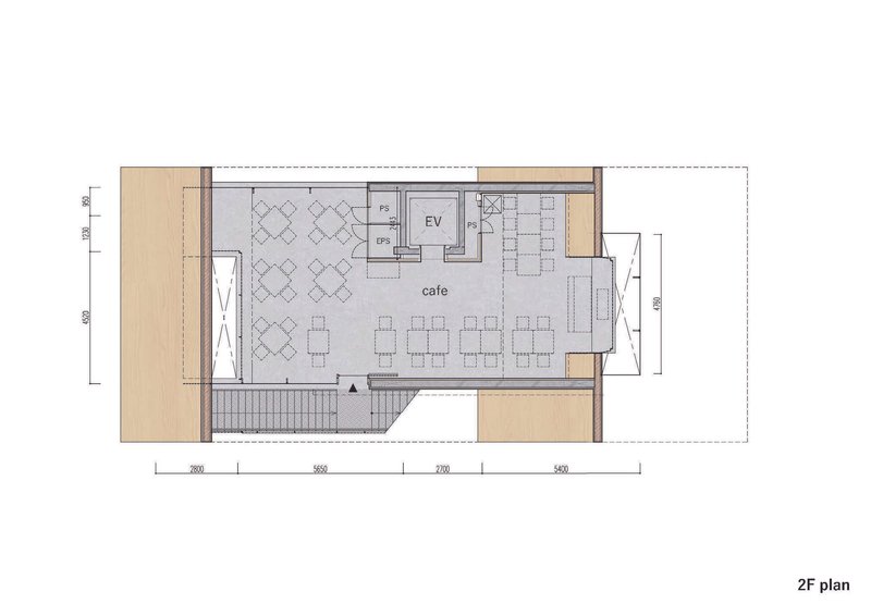 Second floor plan drawing depicting cafe seating area with restrooms and elevator in muted tones