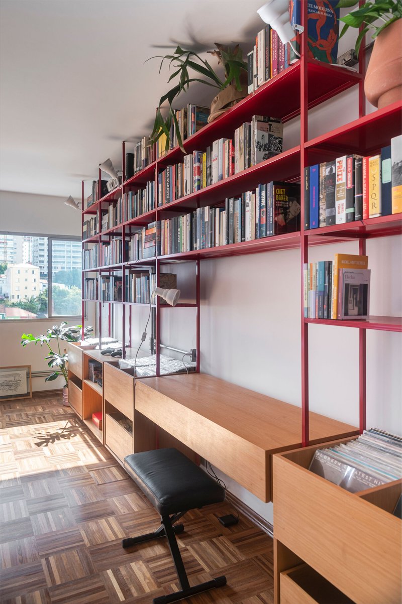 COTA760 Wraps a São Paulo Apartment in a Continuous Red Steel Bookshelf