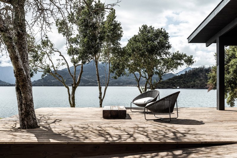 blaq arquitectos Threads a Black Pine Cabin Through the Trees on Chile's Ranco Lake