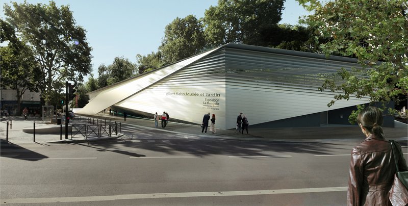Street view of the angular white metal facade lifting toward the sky with pedestrians and trees