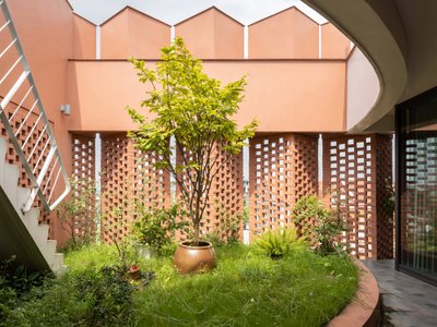 H&P Architects Wrap a Vietnamese House in Perforated Brick to Fuse Living with Agriculture