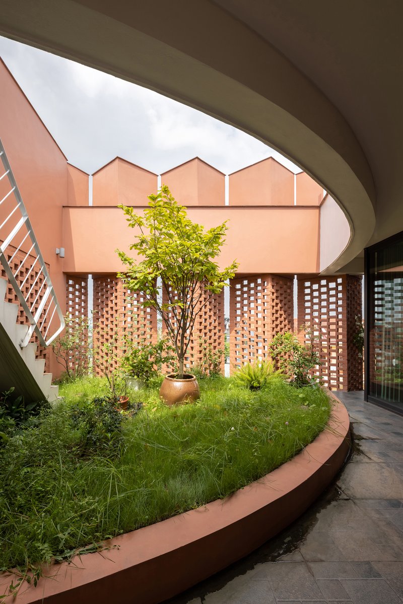 H and P Architects Wrap a Vietnamese House in Perforated Brick to Fuse Living with Agriculture