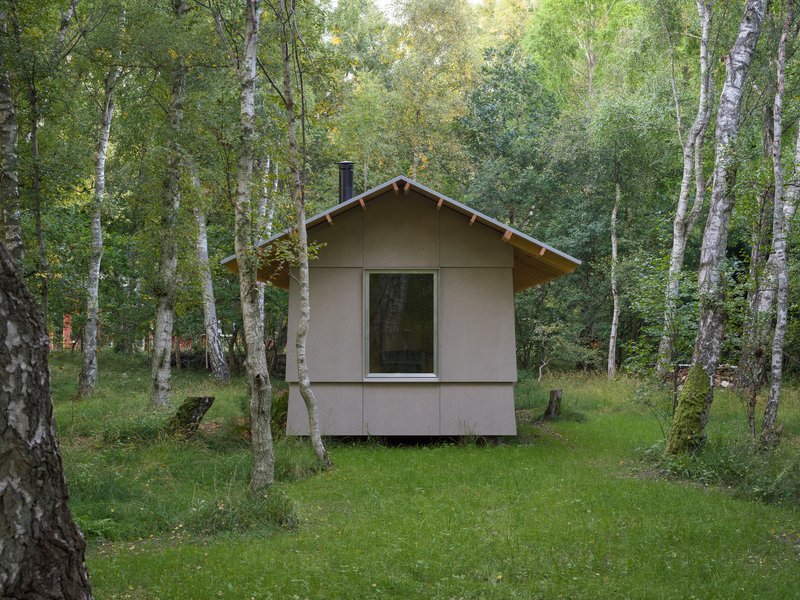 Front elevation of the gabled annex volume with single window nestled between birch trees