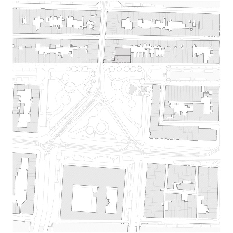 Site plan drawing showing the building footprint within surrounding urban blocks and intersecting streets
