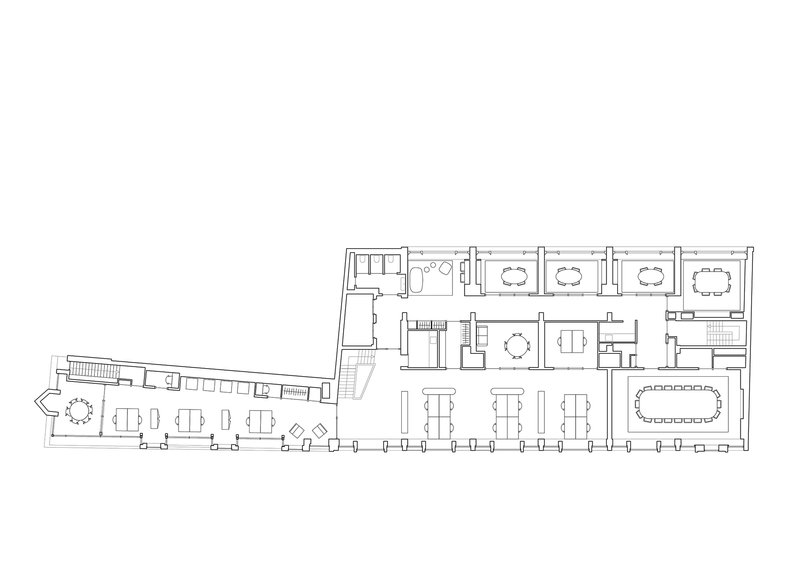 Floor plan drawing showing office spaces with conference rooms and furniture layouts