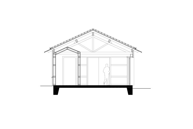 Section drawing showing a pitched roof structure with exposed trusses and a figure for scale