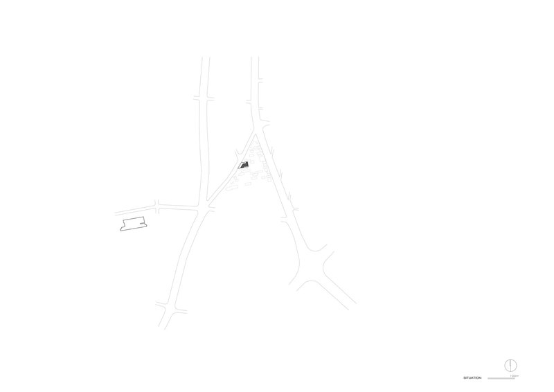 Site plan drawing showing an angular building footprint at an intersection with adjacent streets