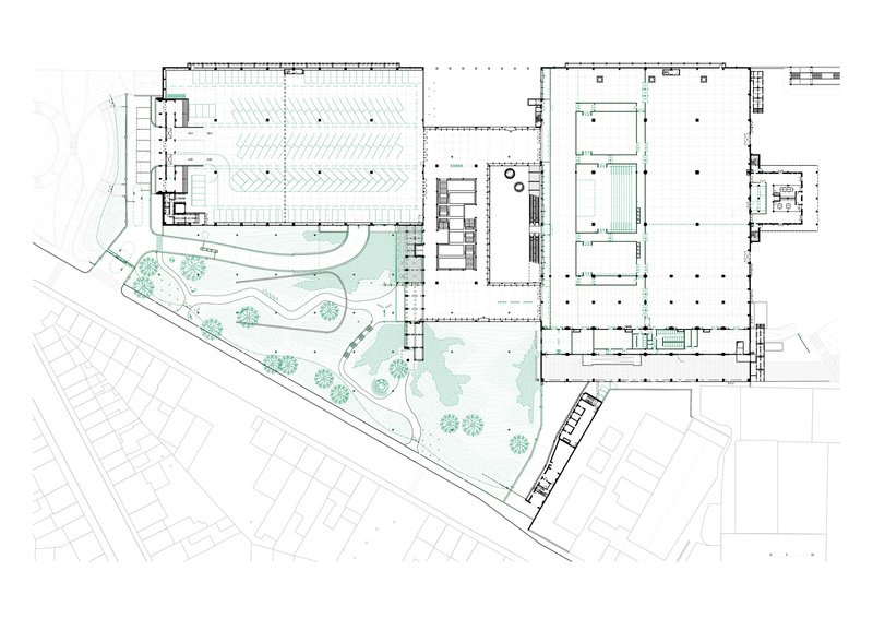Site plan drawing showing the triangular complex with landscaped garden areas and adjacent street grid