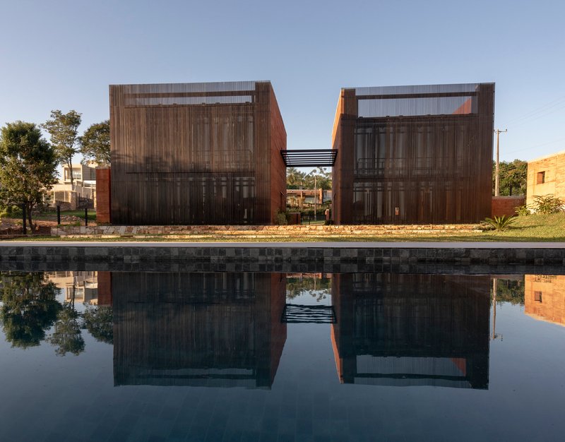 BAUEN Builds Two Rammed Earth Volumes in Paraguay Inspired by the Ovenbird's Nest