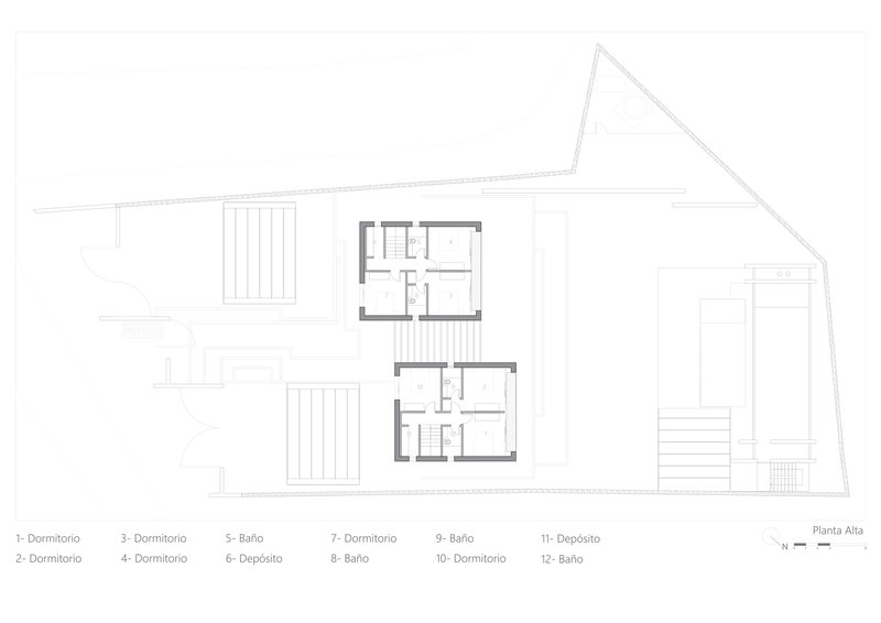 Upper floor plan illustrating bedrooms and bathrooms arranged in mirrored residential units