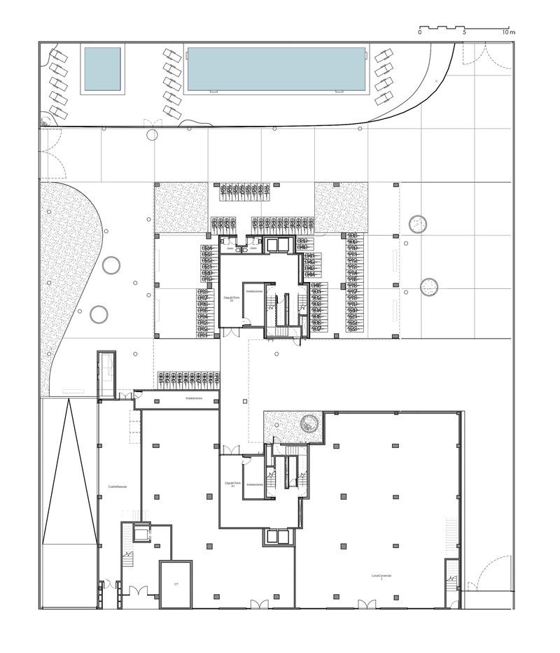 Ground floor plan drawing depicting two buildings with courtyard spaces and surrounding landscape elements
