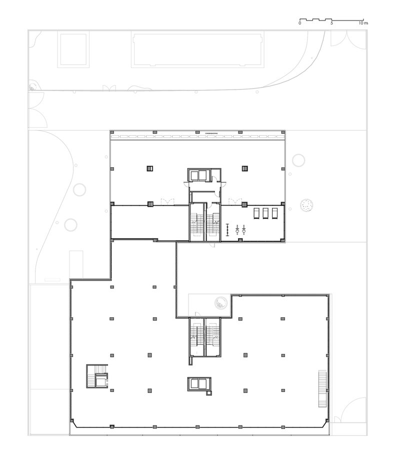 First floor plan drawing showing two buildings with central circulation cores and open office spaces