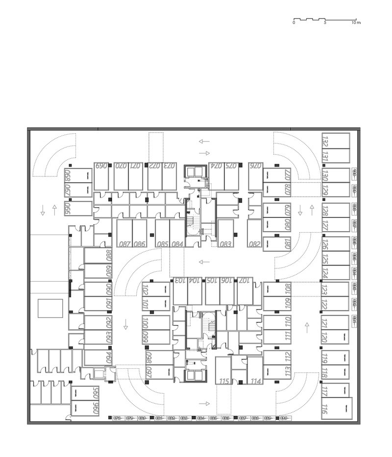 Floor plan drawing showing residential level with numbered units radiating from twin cores and parking along curved edges