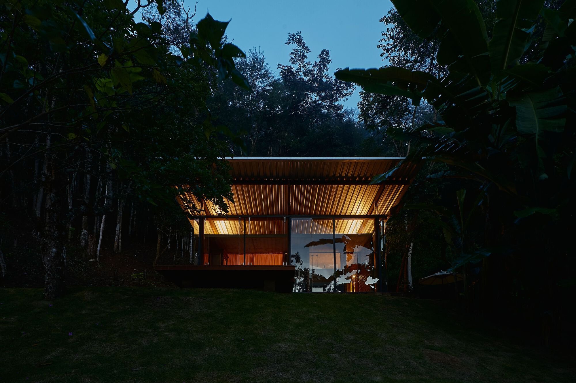 gru.a Distills Domestic Life into a 50-Square-Meter Glass and Brick Shelter in the Brazilian Mountains