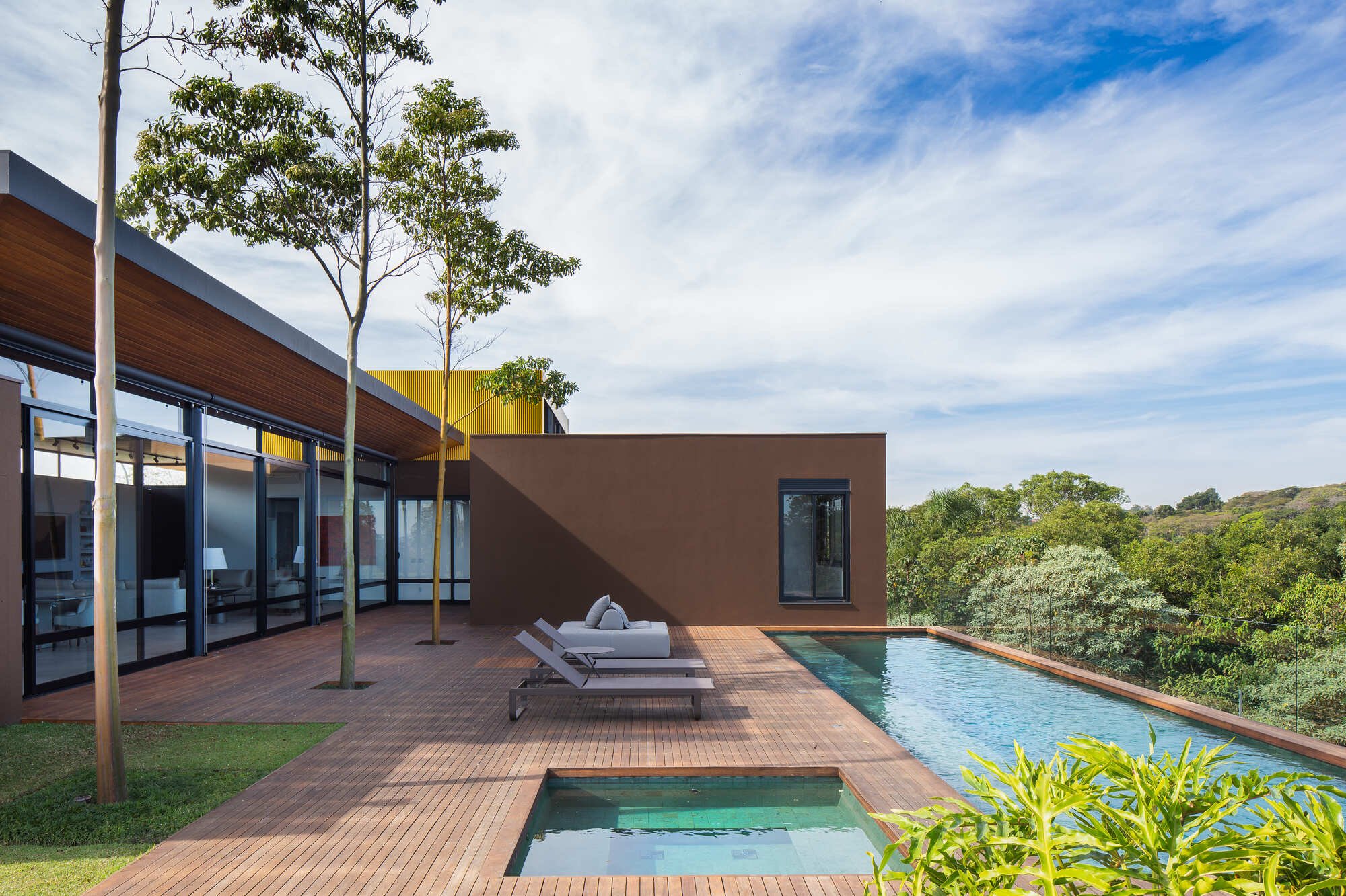 Ximenes Leite Arquitetura Grounds a São Paulo Residence in Earth Tones and Horizontal Restraint