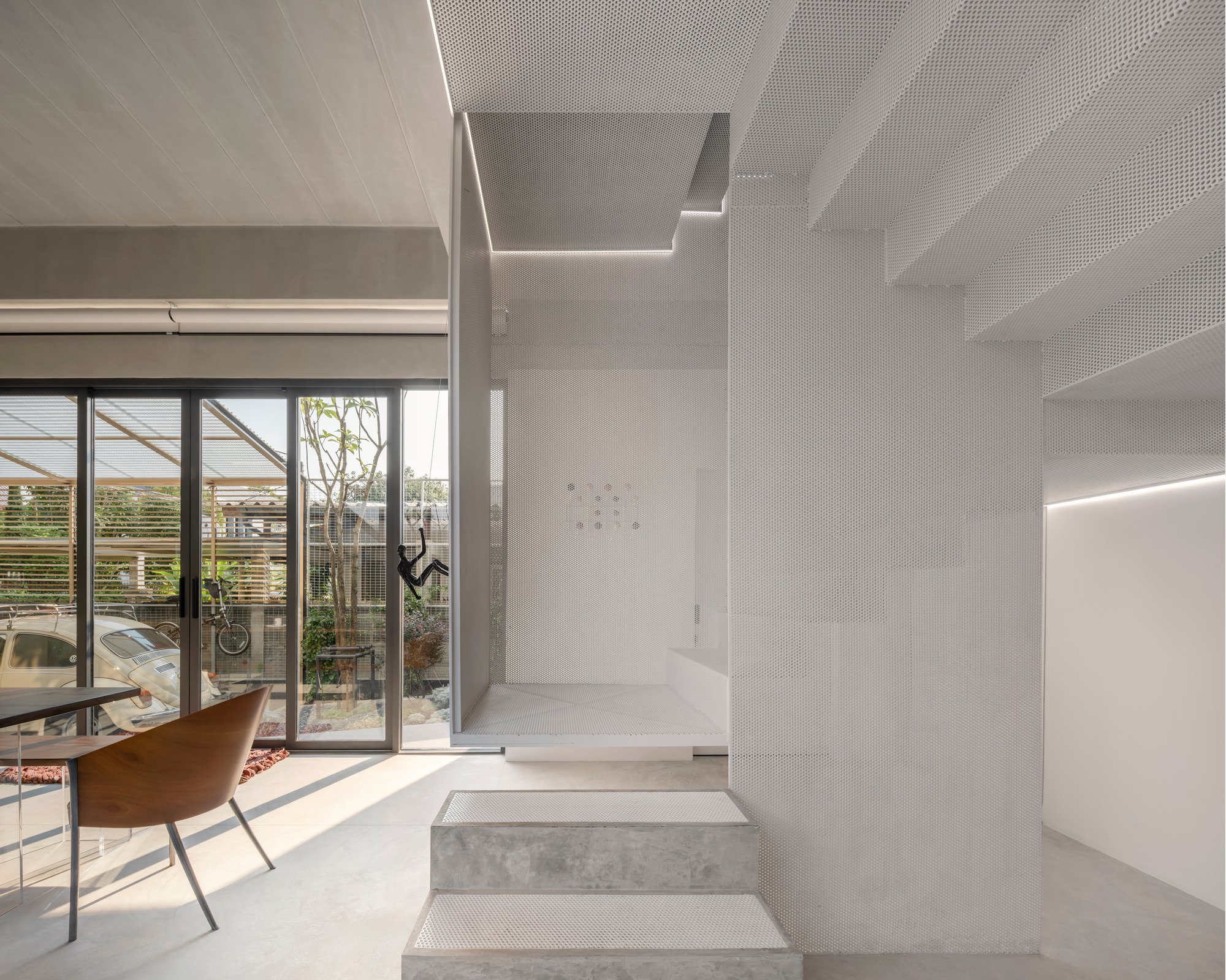 AUN Design Studio Folds an Origami Staircase Through a Multi-Generational Bangkok Home