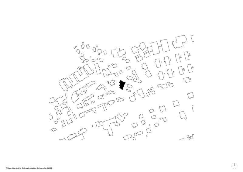 Site plan drawing showing a building footprint highlighted in black among surrounding structures