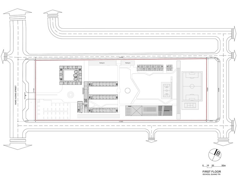 First floor plan with central courtyard, linear classroom wings and eastern sports hall