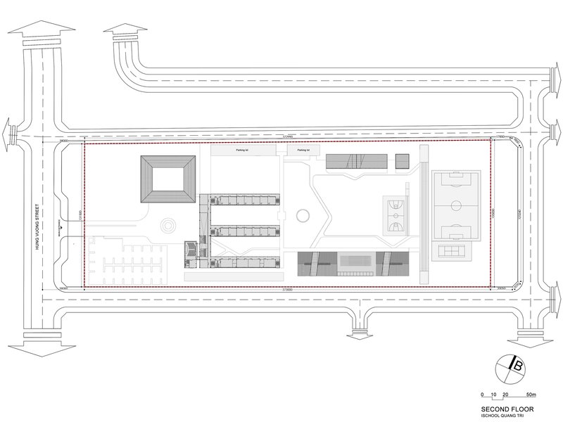 Second floor plan showing central void, offset classroom bars and rooftop terrace areas
