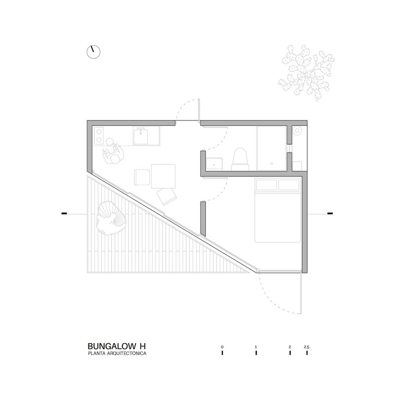Floor plan drawing showing diagonal deck, bathroom, bedroom, and spiral staircase in angled layout