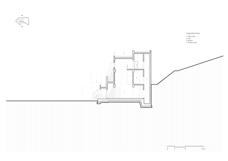 Section drawing showing split-level interior spaces stepping upward against the rising hillside