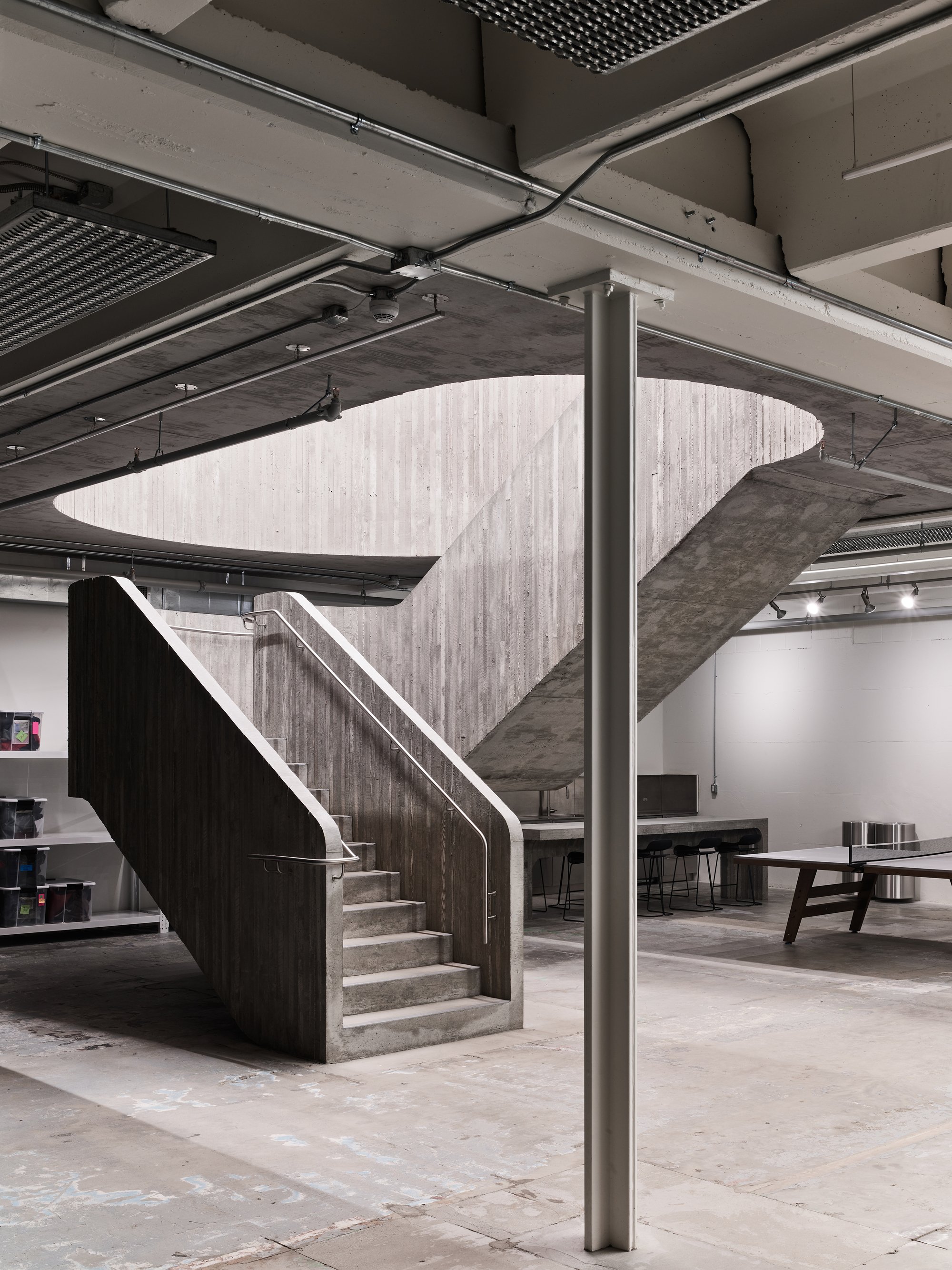 Scott & Scott Architects Carve a Concrete Staircase Through a 1973 Vancouver Warehouse for Purple Brand