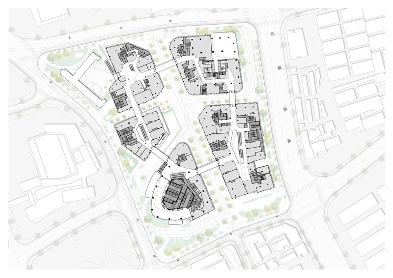 Site plan drawing depicting mixed building footprints with landscape elements and adjacent street grid