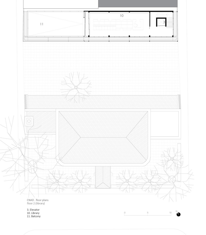 Second floor plan drawing showing library space with balcony and elevator core