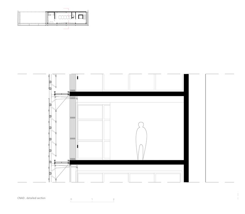 Detailed section drawing showing two floor levels with a human figure for scale and structural connections
