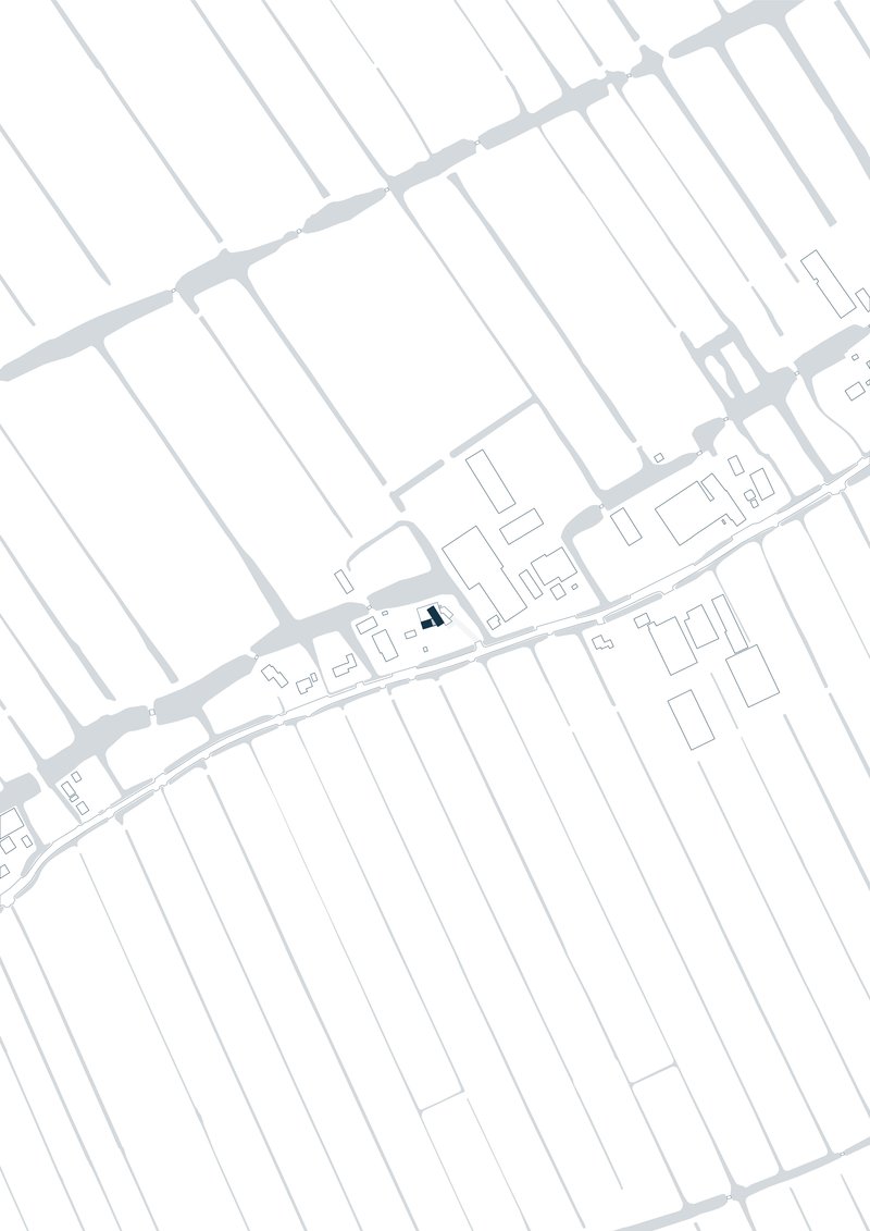 Site plan drawing showing building footprints along a diagonal street with a highlighted structure