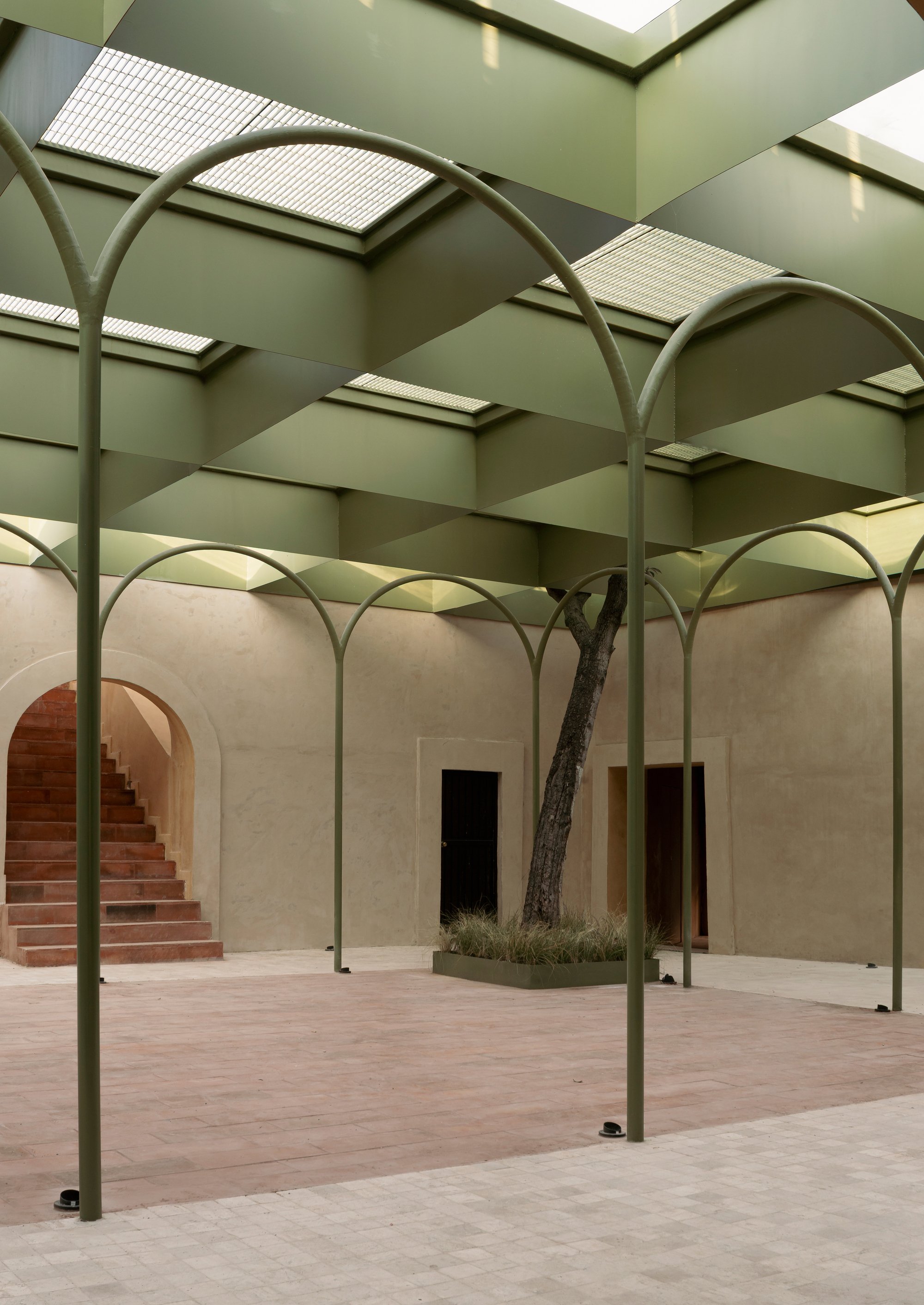 OMAC Arquitectos Restores a 19th-Century Bernal Courtyard into a Skylit Shopping Center