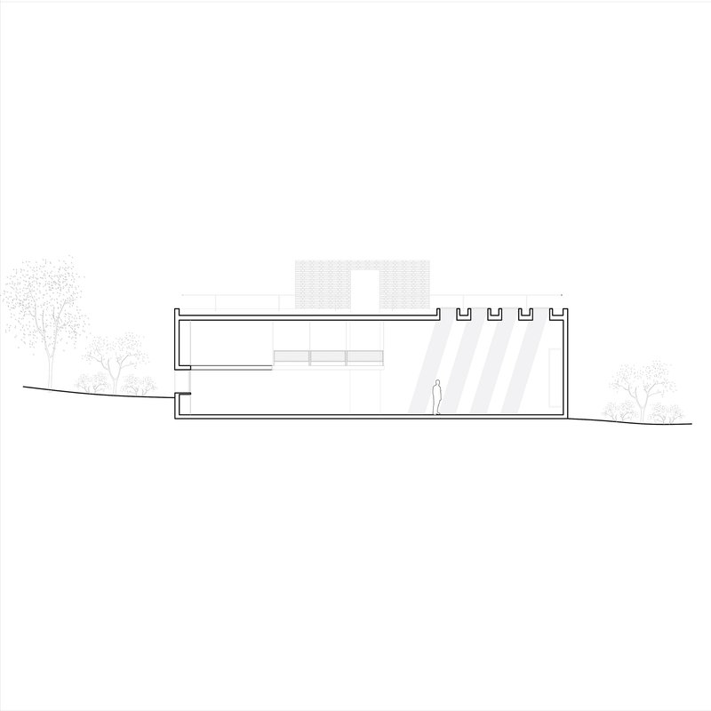 Section drawing showing a two-level structure with rooftop parapets and a human figure for scale
