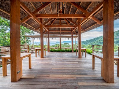 Chi.Arch Nests a Hillside Bar into Vietnamese Rock and Forest with Nothing but Wood and Coconut Leaf