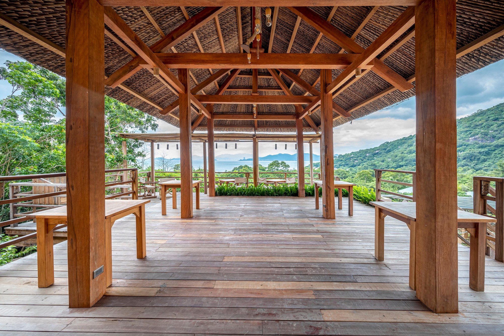 Chi.Arch Nests a Hillside Bar into Vietnamese Rock and Forest with Nothing but Wood and Coconut Leaf
