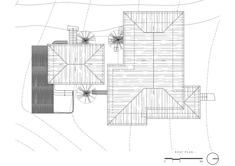 Roof plan drawing showing multiple gabled volumes with diagonal hatching and spiral stair symbols