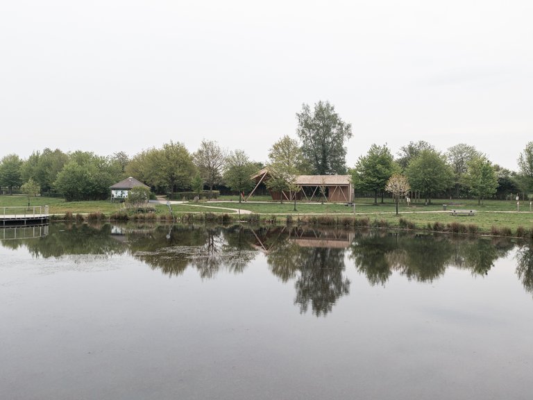 Atelier MA Builds a Twisting Timber Pavilion at the Edge of a French Forest Pond