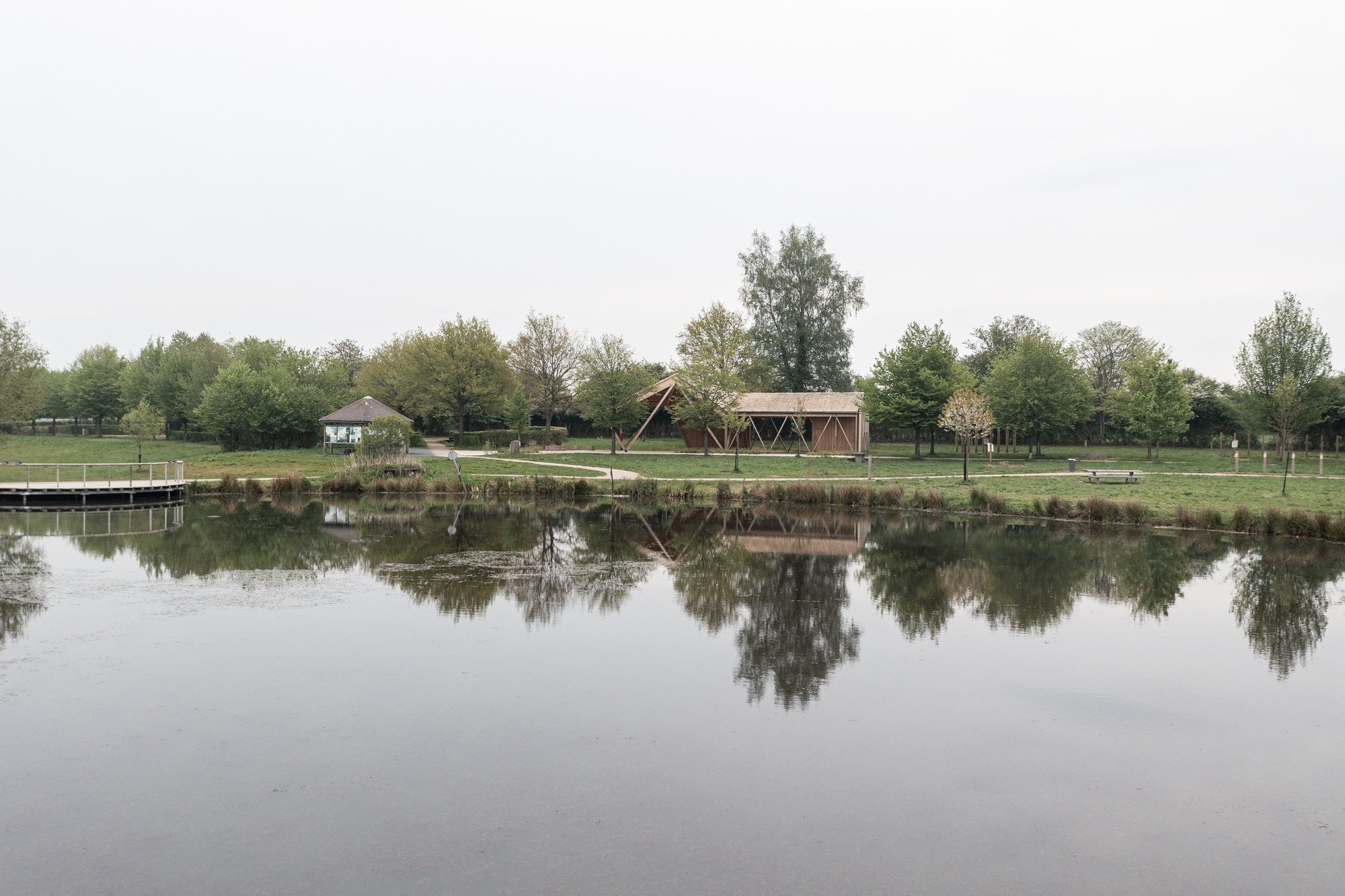 Atelier MA Builds a Twisting Timber Pavilion at the Edge of a French Forest Pond