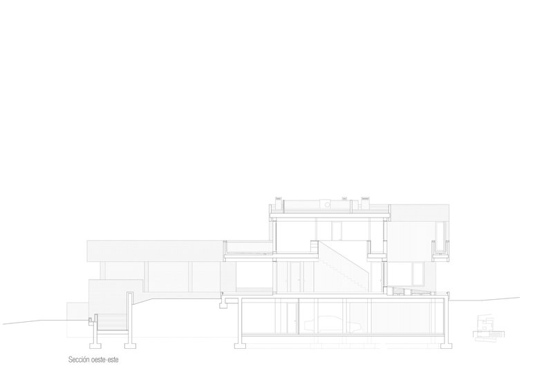 Section drawing showing the split-level arrangement and structural system across the sloping terrain