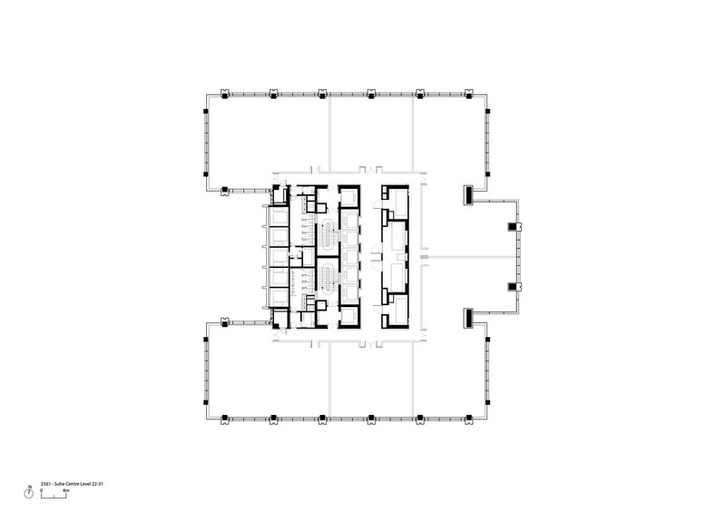 Floor plan showing central service core with stairwells and open floor area within column grid