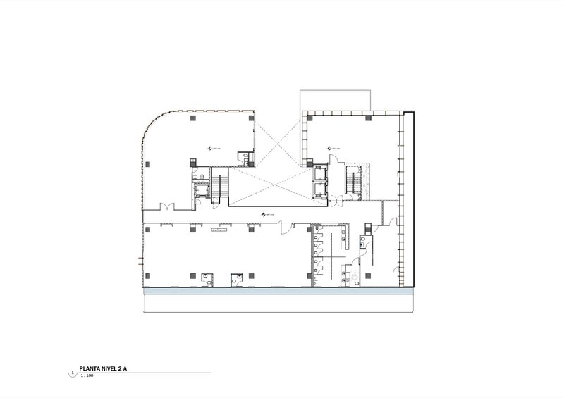 Second level floor plan showing central skylit atrium with diagonal bracing and elevator cores