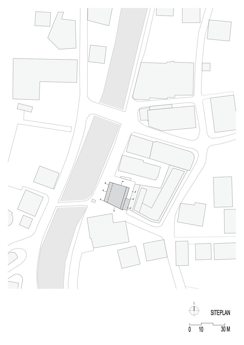 Site plan drawing showing building footprint and street layout in the surrounding urban context