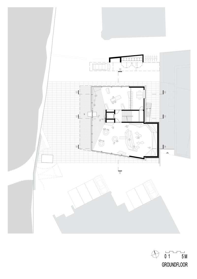 Ground floor plan drawing showing interior layout with terrace, stairs, and adjacent parking area