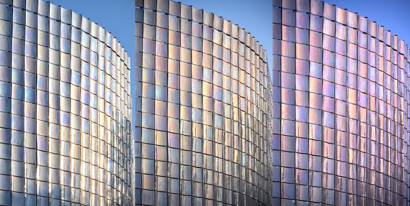 Faceted curves of the iridescent glass panel cladding showing gradations of reflected light