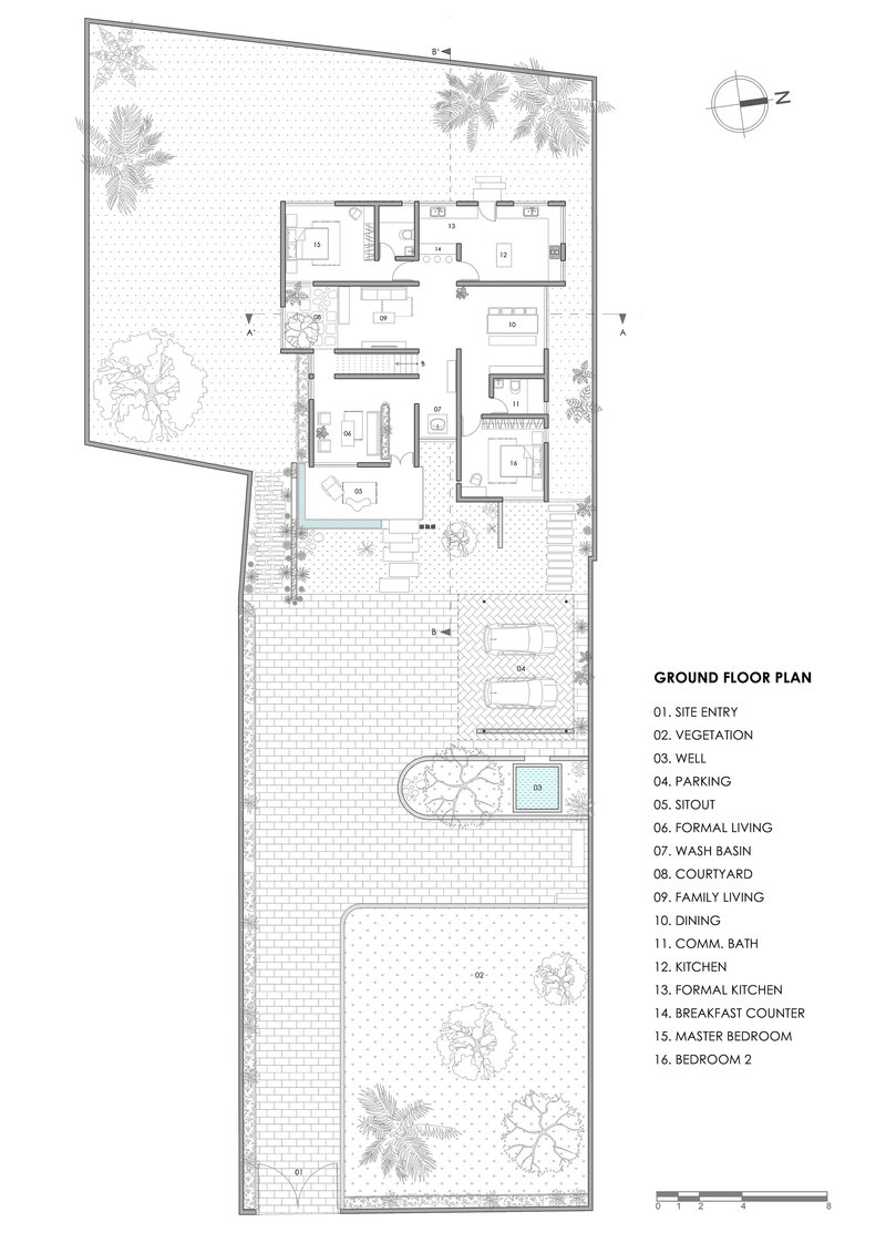 Ground floor plan showing living spaces, courtyard, parking area, and surrounding landscape with trees