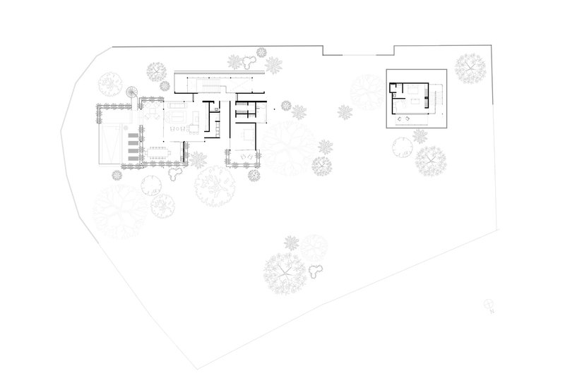 Floor plan drawing showing main living pavilion and detached guest structure among landscape planting