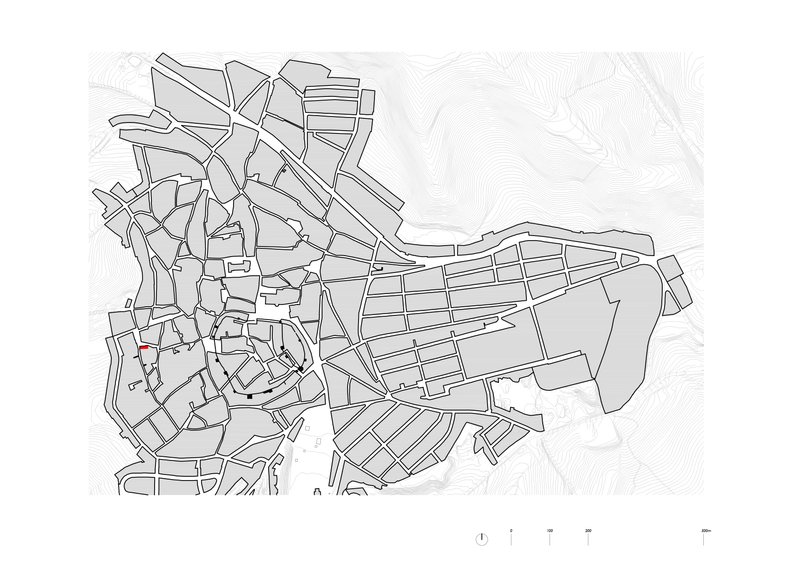 Urban plan drawing showing the street network and building footprints with topographic contour lines