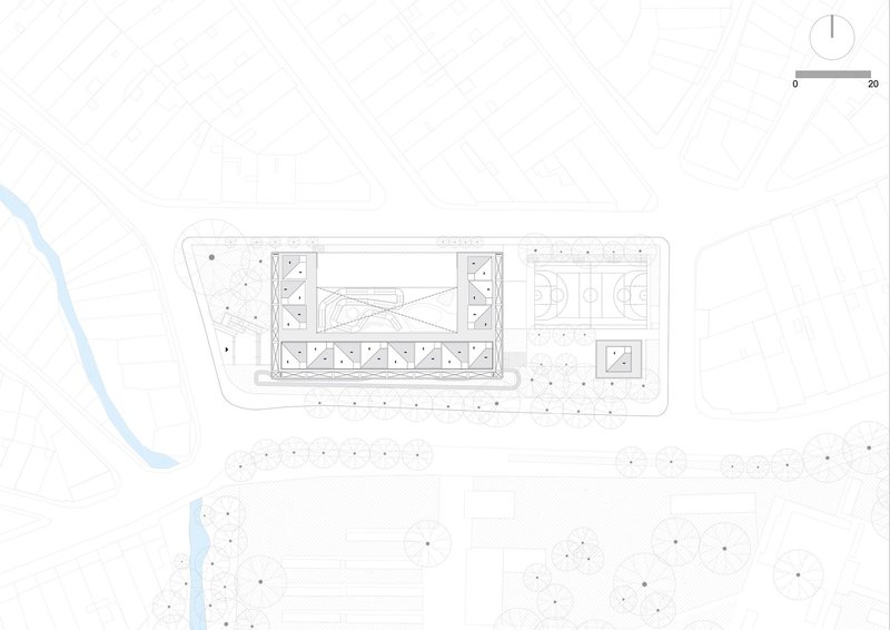 Site plan drawing depicting rectangular building footprint with sports courts surrounded by scattered landscape circles