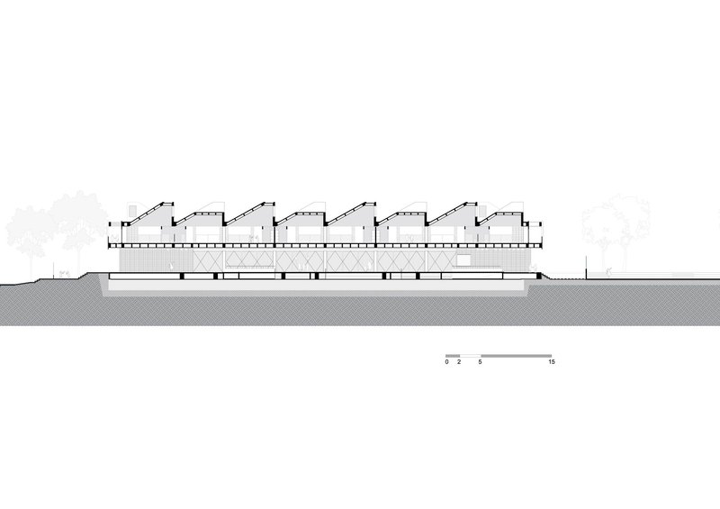 Section drawing illustrating a horizontal volume with four repetitive sawtooth roof monitors above ground level